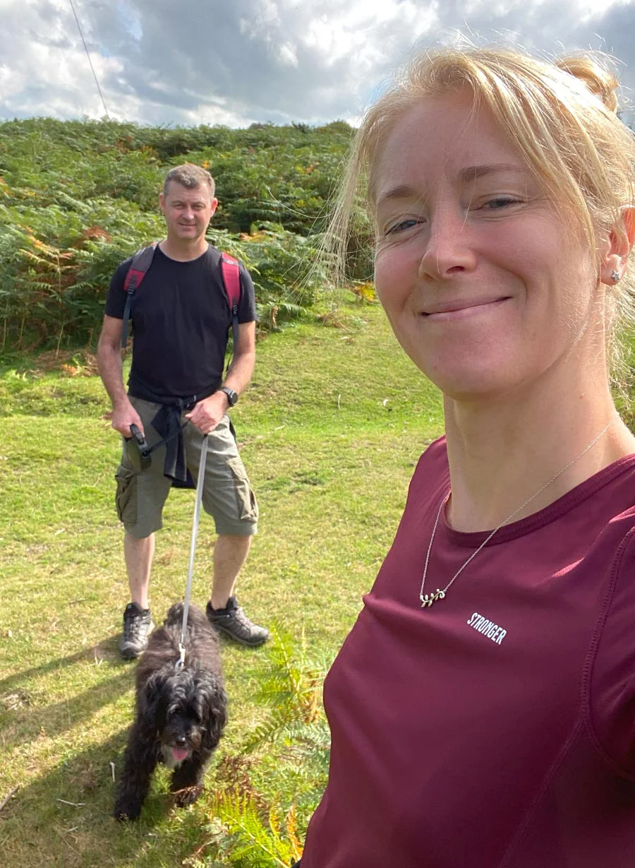 Melanie and Nicholas walking together in the Pembrokeshire countryside.
