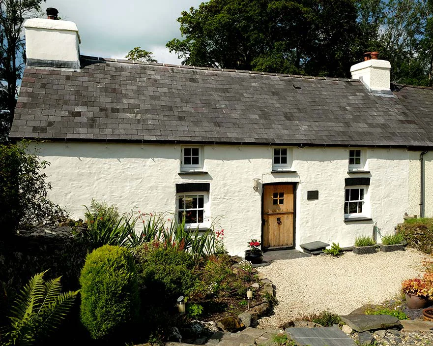 A quaint stone cottage nestled in the West Wales countryside.