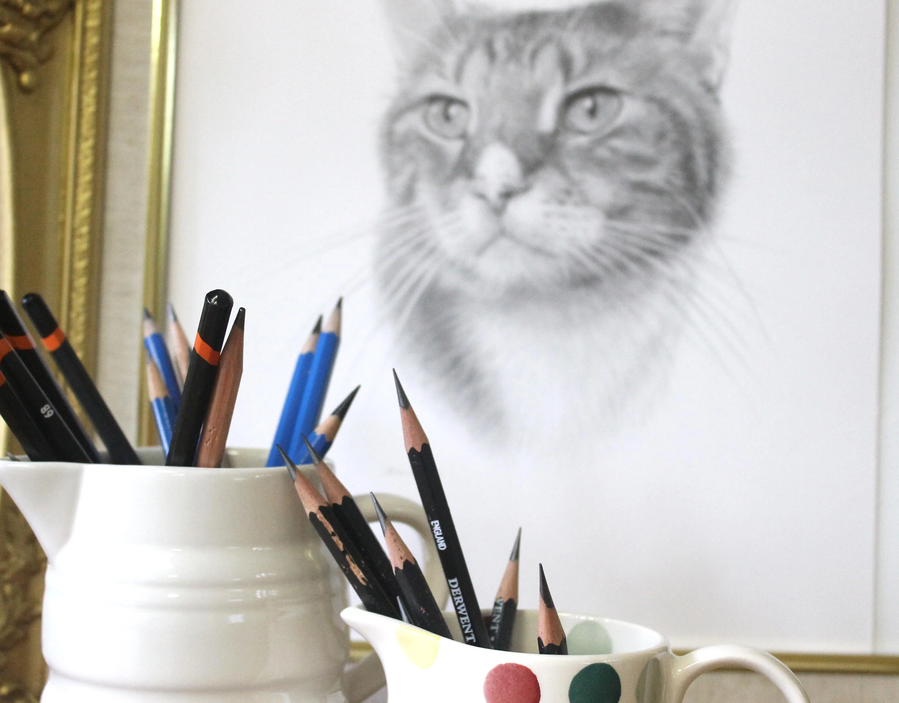 Angled view of Tyson's pencil portrait on a flat surface, with pencils for scale.