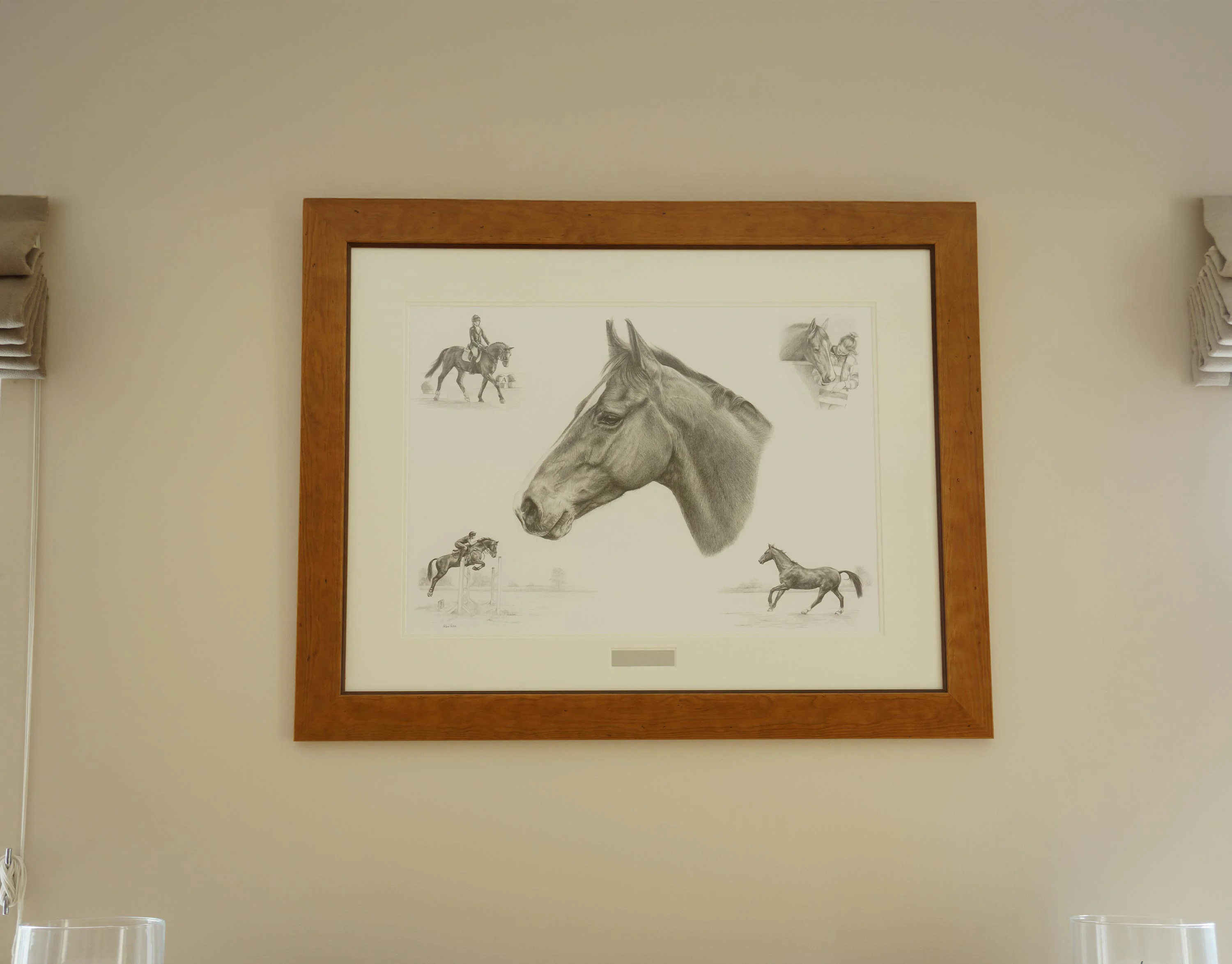 The framed Life Story Portrait pencil portrait of Cassanova the horse hanging proudly on a wall.